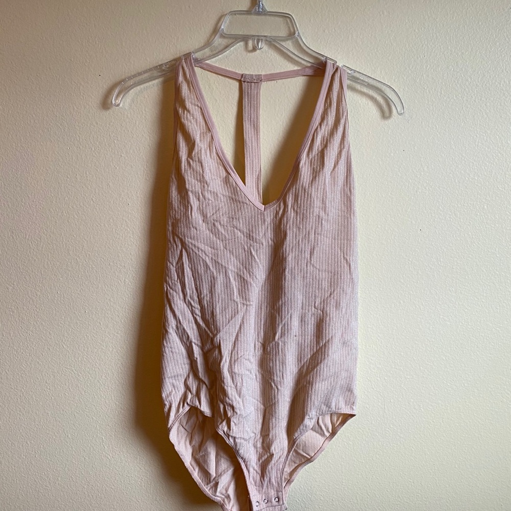 Light pink body suit